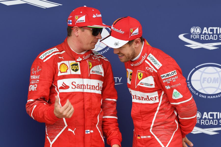 Kimi Raikkonen and Sebastian Vettel celebrate in parc ferme