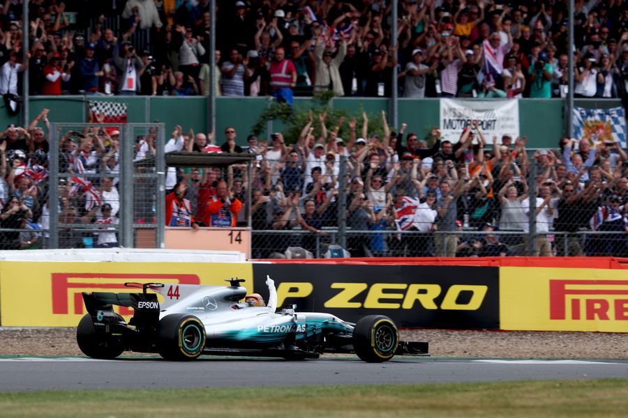 Race winner Lewis Hamilton celebrates