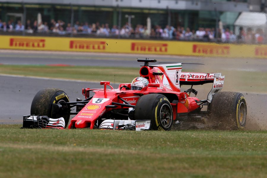 Sebastian Vettel with runs wide front delaminating tyre