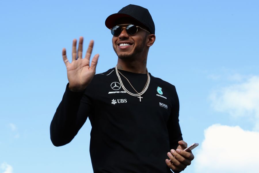 Lewis Hamilton waves to fans