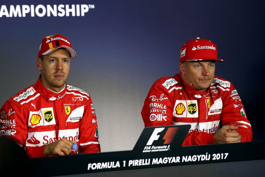 Pole sitter Sebastian Vettel and Kimi Raikkonen in the Press Conference