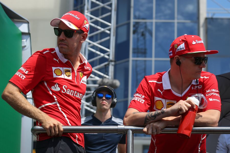 Sebastian Vettel and Kimi Raikkonen on the drivers parade