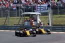 Nico Hulkenberg passes Jolyon Palmer in the Renault