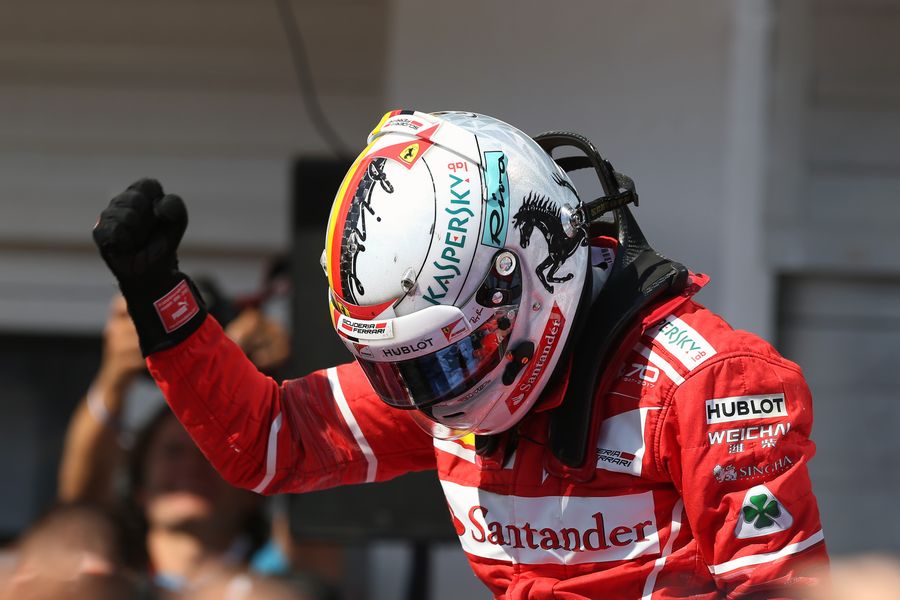 Sebastian Vettel celebrates on the palc ferme