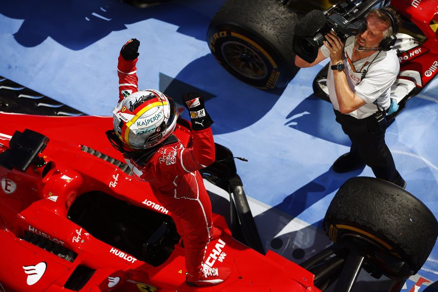 Race winner Sebastian Vettel celebrates in parc ferme
