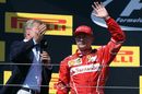 Kimi Raikkonen celebrates on the podium with David Coulthard