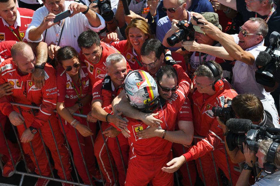 Sebastian Vettel cerebrates with Ferrari