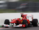 Felipe Massa peers out of his cockpit as he narrowly misses the wall