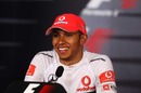 A happy Lewis Hamilton faces the press