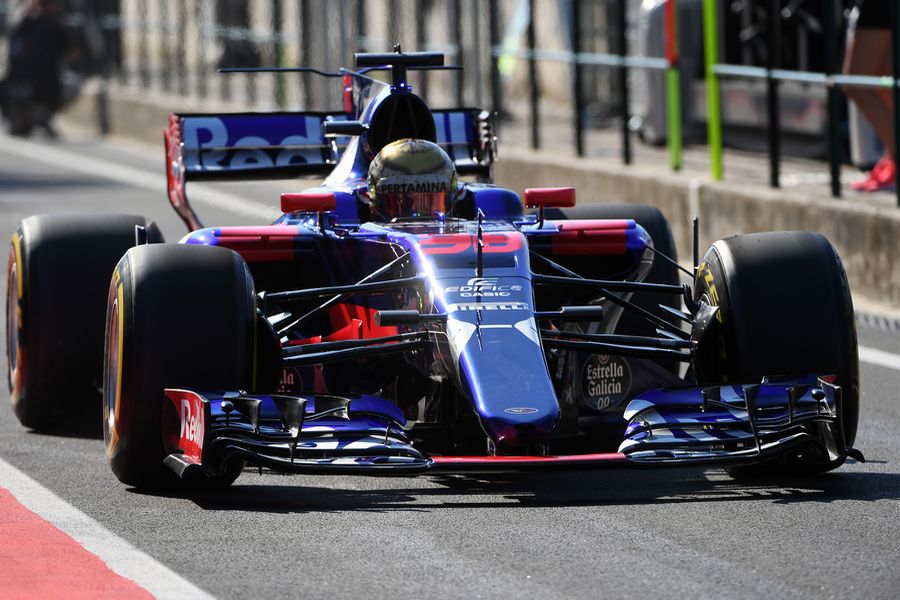 Sean Gelael powers down the pit lane in the Toro Rosso