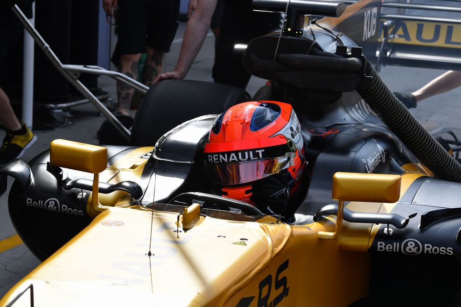 Robert Kubica sits in the Renault cockpit