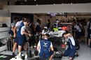 Mechanics work on the car of Felipe Massa in the garage