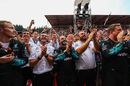Mercedes team mechanics celebrate in parc ferme