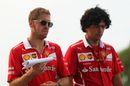 Sebastian Vettel walks the track