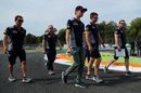 Daniil Kvyat walks the track with the team