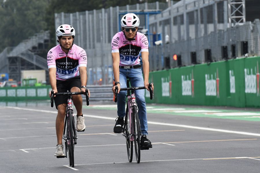 Sergio Perez and Esteban Ocon cycle the track