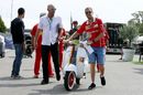 Sebastian Vettel and Vespa Scooter with Ferrari Livery