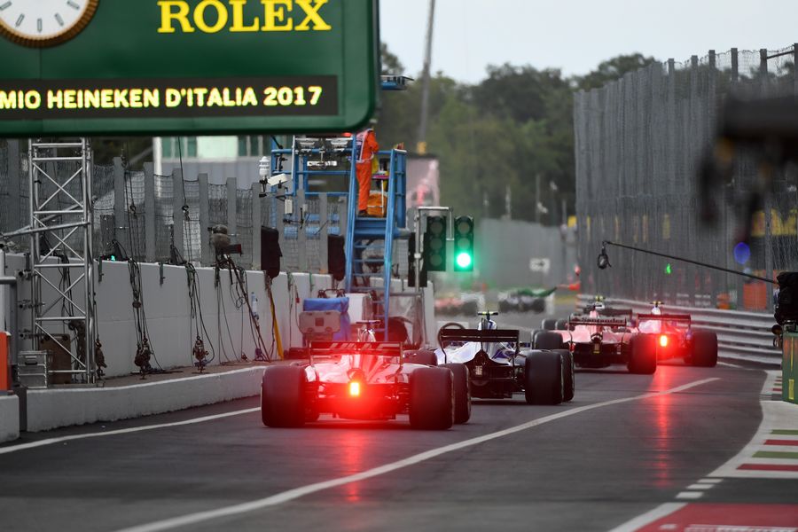 Romain Grosjean heads down the pit lane in the Haas