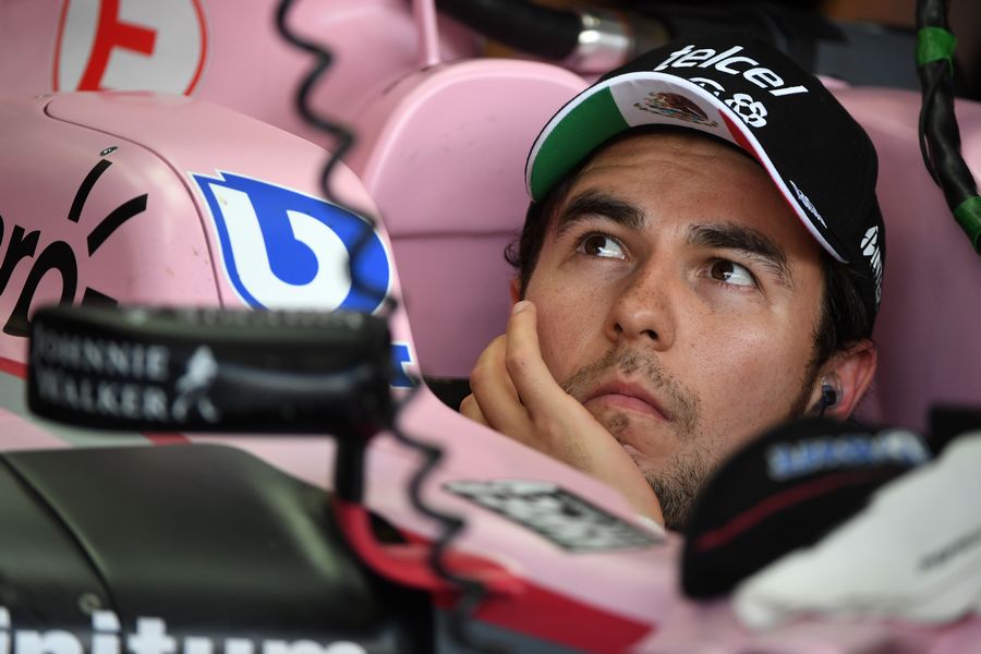Sergio Perez sits in the Force India cockpit