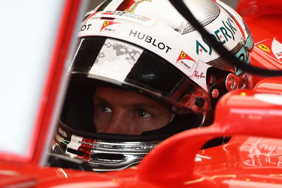 Sebastian Vettel looks on from the Ferrari cockpit