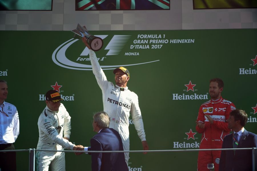 Lewis Hamilton, Valtteri Bottas and Sebastian Vettel celebrate on the podium