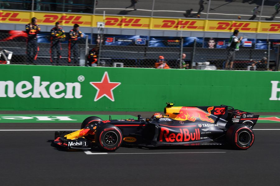Daniel Ricciardo celebrates as he crosses the line for fourth