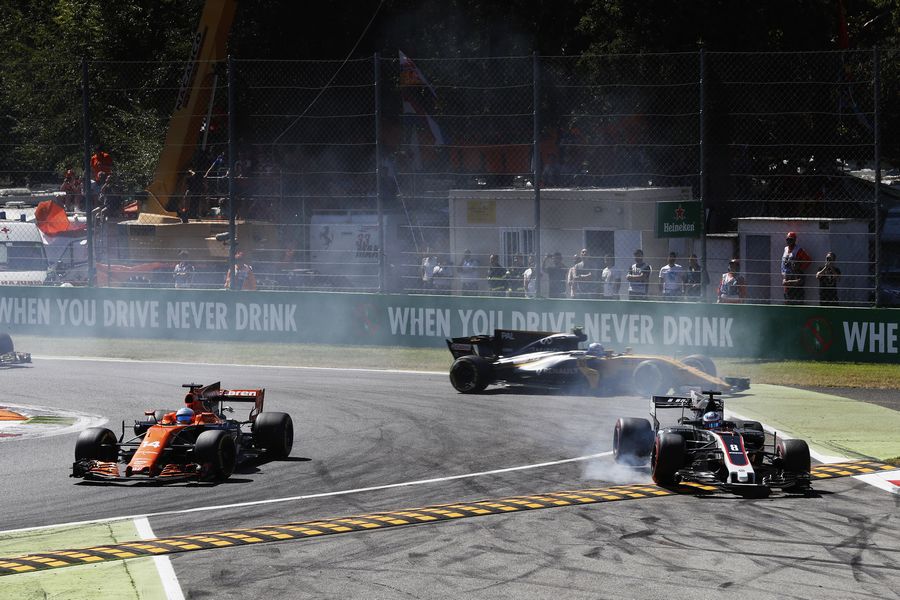 Fernando Alonso, Romain Grosjean and Jolyon Palmer battle