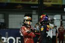Pole sitter Sebastian Vettel celebrates in parc ferme with Max Verstappen