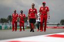 Sebastian Vettel and Riccardo Adami walk the track