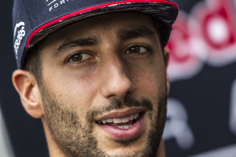 Daniel Ricciardo talks with the media