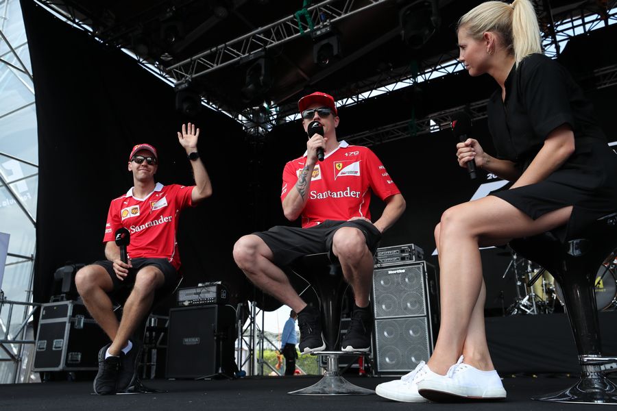 Sebastian Vettel and Kimi Raikkonen on stage
