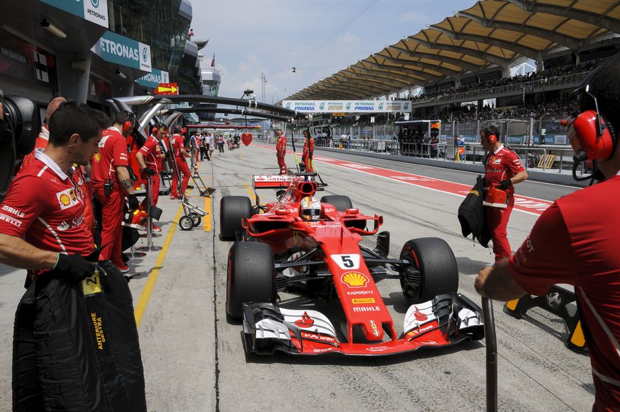 Sebastian Vettel returns to the pit