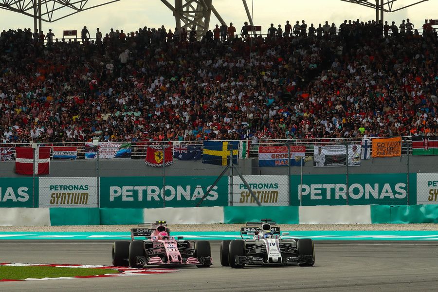 Esteban Ocon and Felipe Massa battle for position