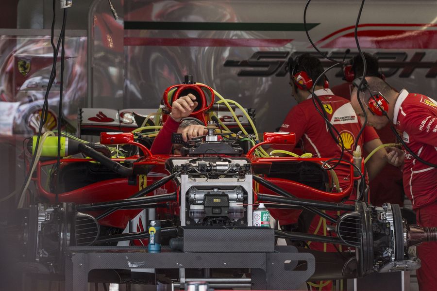 Ferrari mechanic works on the SF70-H