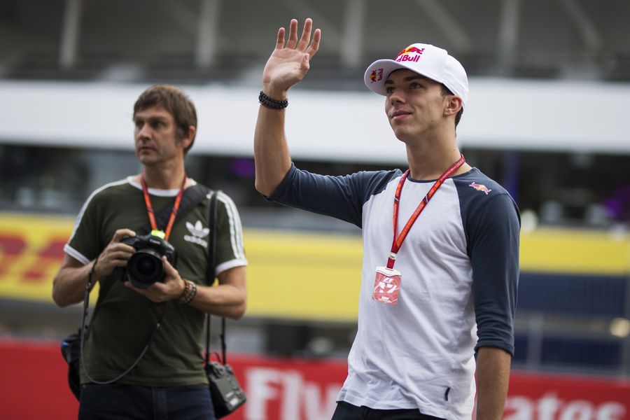 Pierre Gasly waves to the fans