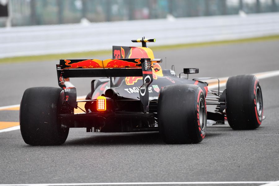 Max Verstappen heads down the pit lane in the Red Bull