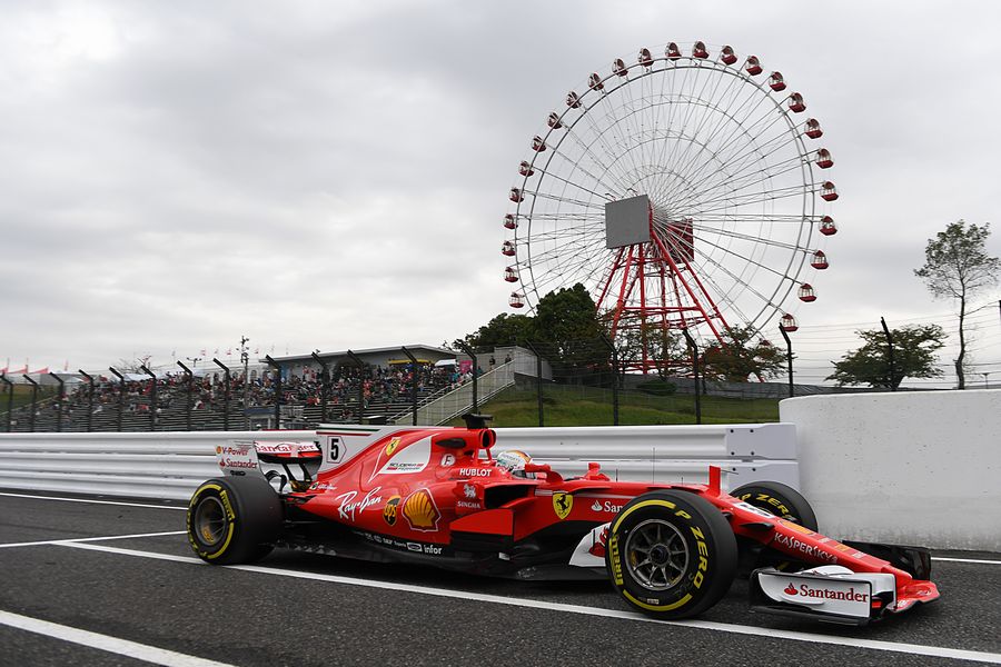 Sebastian Vettel heads down the pit lane in the Ferrari