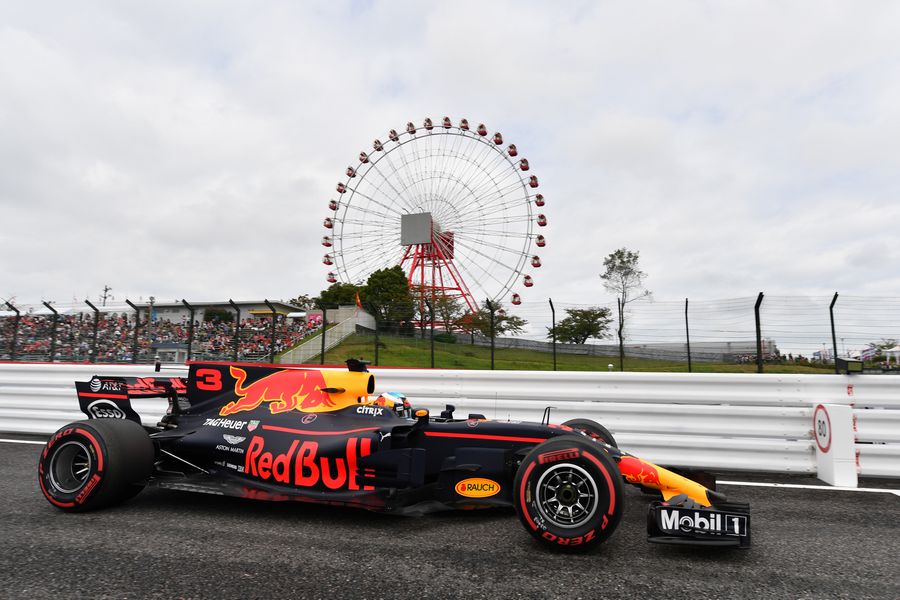 Daniel Ricciardo heads down the pit lane in the  Red Bull