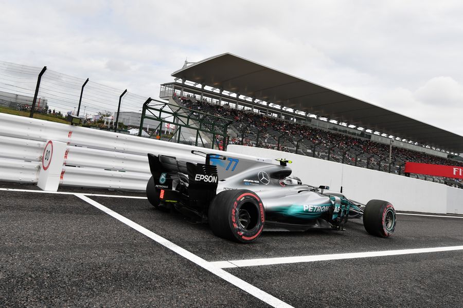 Valtteri Bottas heads down the pit lane in the Mercedes
