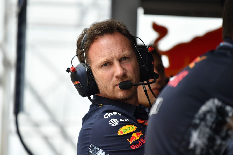 Christian Horner stands on the pit wall