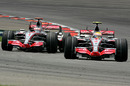 Lewis Hamilton leads Fernando Alonso through the chicane