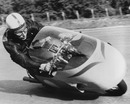 John Surtees testing a motorbike on the high-speed Monza circuit