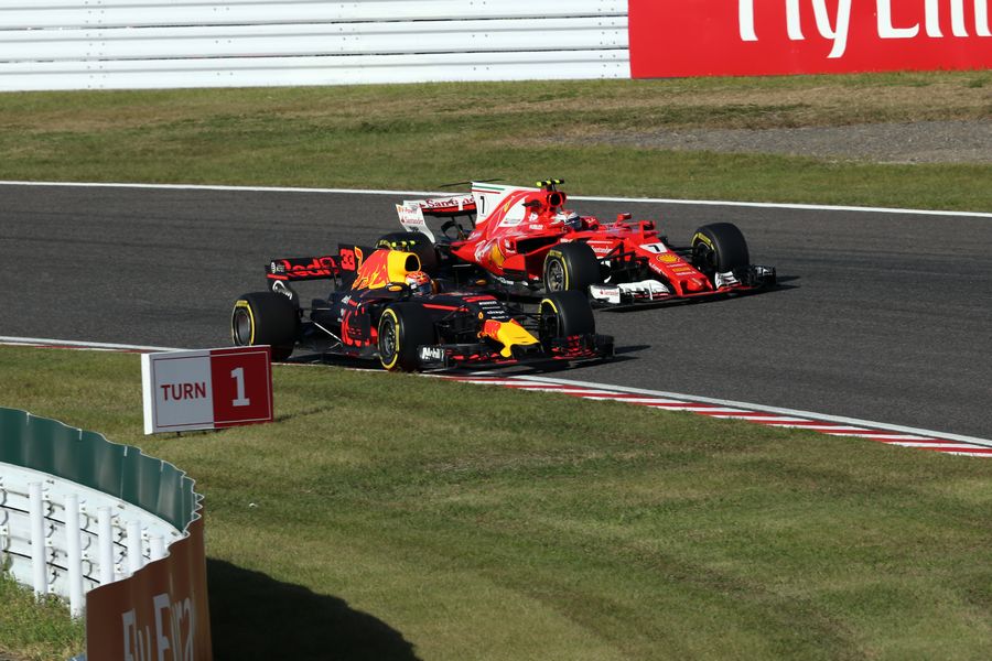 Max Verstappen and Kimi Raikkonen battle for position