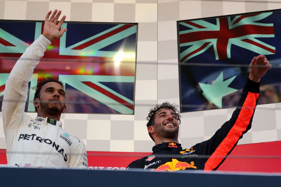 Race winner Lewis Hamilton and Daniel Ricciardo celebrate on the podium