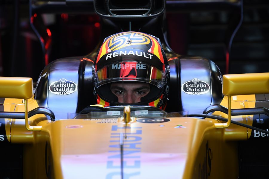 Carlos Sainz jr looks on from the Renault cockpit