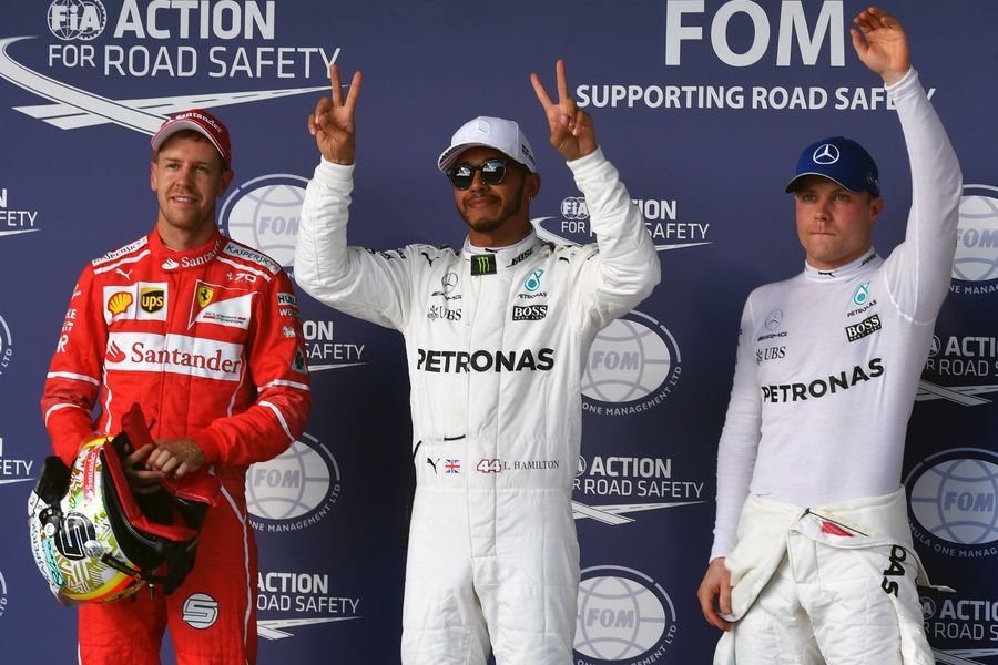 The top three acknowledge the crowd after qualifying
