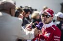Sebastian Vettel talks with the media