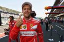 Pole sitter Sebastian Vettel celebrates in parc ferme