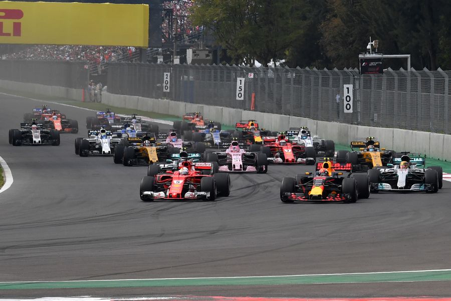 Max Verstappen and Sebastian Vettel battle at the start of the race