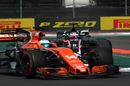 Fernando Alonso and Romain Grosjean battle